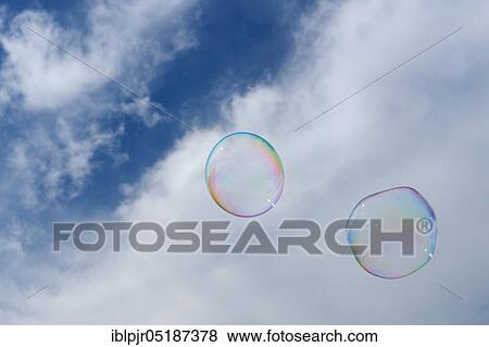 Soap bubbles hover in the air View Large Photo Image Stock Photo - Soap bubbles hover in the air. Fotosearch