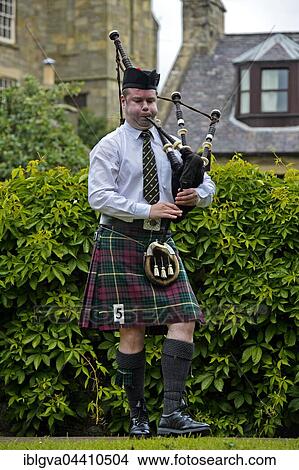Solo bagpiper playing bagpipes in kilt, Bagpiper Music Competition, Ceres Highland Games, Ceres, Scotland, United Kingdom, Europe View Large Photo Image Picture - Solo bagpiper playing bagpipes in kilt, Bagpiper Music Competition, Ceres Highland Games, Ceres, Scotland, United Kingdom, Europe. Fotosearch