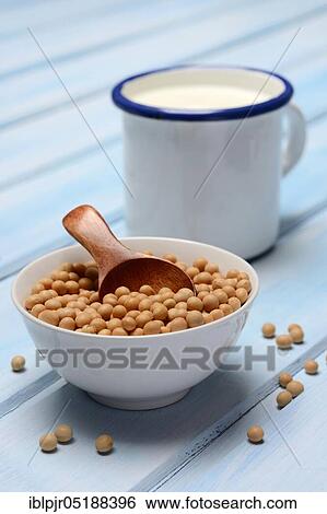 Stock Photograph - Soy, soybeans in shell and soy milk in cup. Fotosearch