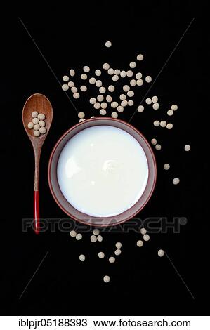 Stock Image - Soya, soya milk in shell and soya beans. Fotosearch