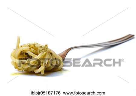 Stock Photograph - Spaghetti with pesto on fork, pesto alla genovese. Fotosearch