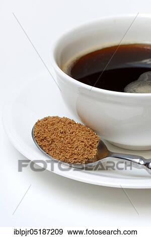 Spoon with coconut blossom sugar, coffee cup with coffee View Large Photo Image Stock Photo - Spoon with coconut blossom sugar, coffee cup with coffee. Fotosearch