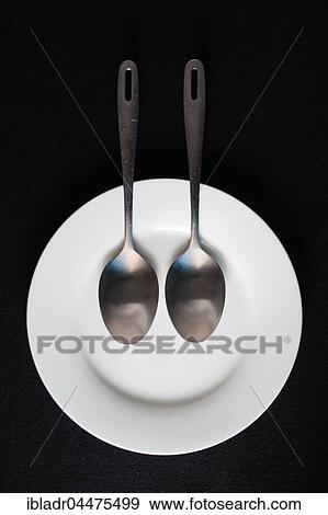 Spoons on plate, laughing face View Large Photo Image Stock Photo - Spoons on plate, laughing face. Fotosearch