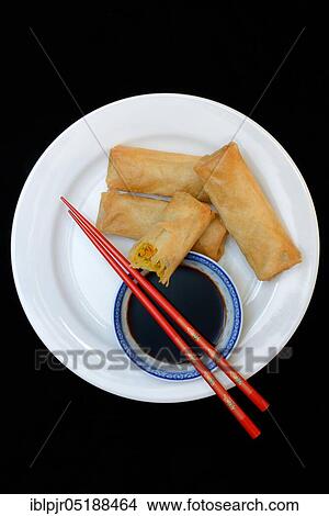 Spring rolls with soy sauce View Large Photo Image Picture - Spring rolls with soy sauce. Fotosearch