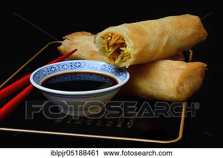 Stock Image - Spring rolls with soy sauce. Fotosearch