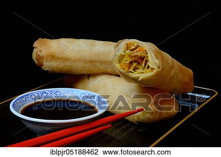 Stock Image - Spring rolls with soy sauce. Fotosearch