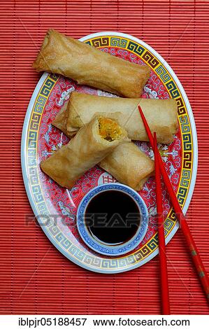 Stock Photo - Spring rolls with soy sauce. Fotosearch