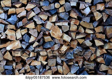 Stock Photograph - Stacked firewood, logs, logs, storage. Fotosearch