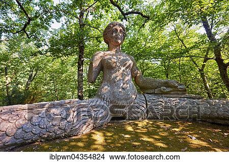 Statue of Echidina, mother of the many enemies of Hercules, Park of Monsters or The Sacred Wood of Bamarzo, Bomarzo, Lazio, Italy, Europe View Large Photo Image Picture - Statue of Echidina, mother of the many enemies of Hercules, Park of Monsters or The Sacred Wood of Bamarzo, Bomarzo, Lazio, Italy, Europe. Fotosearch