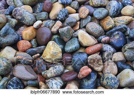 Stock Image - Stones on the beach, Scotland, UK. Fotosearch