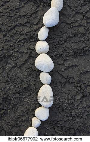 Stock Image - Stones on the beach, Scotland, UK. Fotosearch