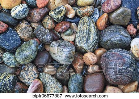 Stock Photo - Stones on the beach, Scotland, UK. Fotosearch