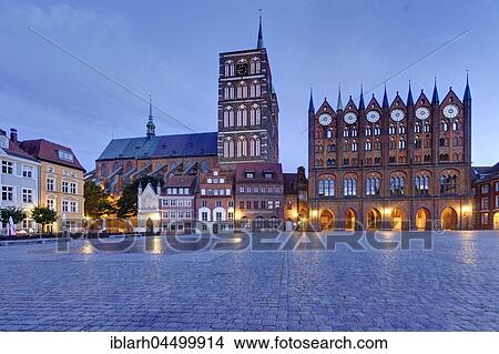 Stralsund Town Hall with show facade, St. Nicholas Church, Twilight, Alter Markt, Stralsund, Mecklenburg-Western Pomerania, Germany, Europe View Large Photo Image Picture - Stralsund Town Hall with show facade, St. Nicholas Church, Twilight, Alter Markt, Stralsund, Mecklenburg-Western Pomerania, Germany, Europe. Fotosearch