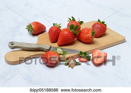 Strawberries on wooden board, Fragaria x ananassa View Large Photo Image Stock Photograph - Strawberries on wooden board, Fragaria x ananassa. Fotosearch