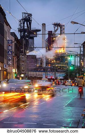 Street with cars in front of ThyssenKrupp Hüttenwerk at night, Bruckhausen, Duisburg, North Rhine-Westphalia, Germany, Europe View Large Photo Image Stock Photograph - Street with cars in front of ThyssenKrupp Hüttenwerk at night, Bruckhausen, Duisburg, North Rhine-Westphalia, Germany, Europe. Fotosearch
