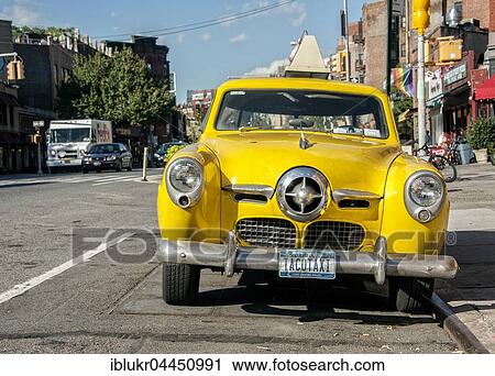 Studebaker Champion, Tacotaxi, Vintage Yellow Cab in front of the restaurant Caliente Cab, 7th Avenue South, Greenwich Village, Manhattan, New York City, United States, North America View Large Photo Image Stock Image - Studebaker Champion, Tacotaxi, Vintage Yellow Cab in front of the restaurant Caliente Cab, 7th Avenue South, Greenwich Village, Manhattan, New York City, United States, North America. Fotosearch