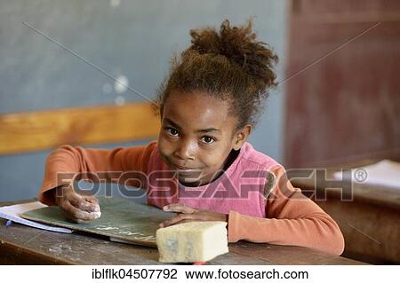 Student, girl, 10 years, writing on board, Primary School, Fianarantsoa, Madagascar, Africa View Large Photo Image Stock Image - Student, girl, 10 years, writing on board, Primary School, Fianarantsoa, Madagascar, Africa. Fotosearch