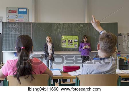 Stock Image - Students giving a presentation about Marco Polo, primary school, Lower Saxony, Germany, Europe. Fotosearch