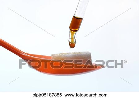 Stock Photography - Sugar cubes on spoon, drops on pipette. Fotosearch