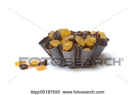 Stock Photography - Sultana, raisins in cake tin, baking tin. Fotosearch