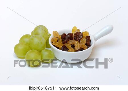 Stock Image - Sultana, raisins in shell and grapes. Fotosearch