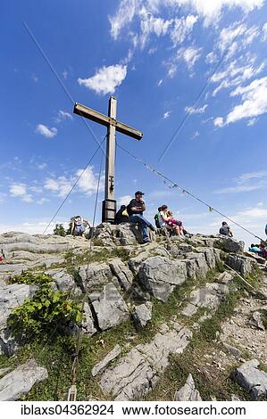 Picture - Summit cross on Staffelstein, beneath the Kampenwand, Aschau, Bavaria, Germany, Europe. Fotosearch