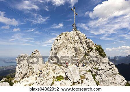 Stock Image - Summit cross on the Kampenwand, Aschau, Bavaria, Germany, Europe. Fotosearch