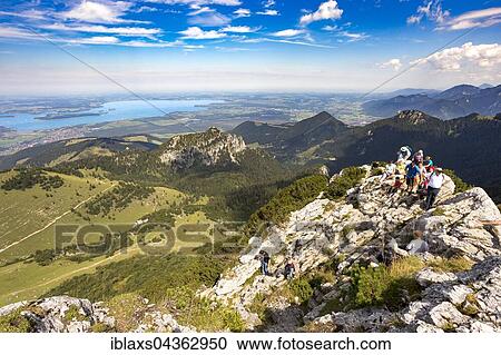 Stock Image - Summit ridge of the Kampenwand, View of Chiemsee Lake, Aschau, Bavaria, Germany, Europe. Fotosearch
