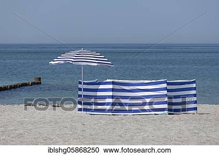 Sunshade and windbreak, blue-white, beach, Baltic resort Wustrow, Mecklenburg-Vorpommern, Germany, Europe View Large Photo Image Stock Image - Sunshade and windbreak, blue-white, beach, Baltic resort Wustrow, Mecklenburg-Vorpommern, Germany, Europe. Fotosearch
