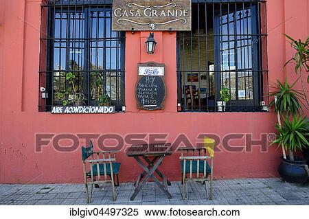 Table with chairs in front of a restaurant with red facade, Colonia del Sacramento, Colonia, Uruguay, South America View Large Photo Image Stock Photography - Table with chairs in front of a restaurant with red facade, Colonia del Sacramento, Colonia, Uruguay, South America. Fotosearch