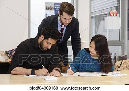Teacher-student situation in an international class, adult education View Large Photo Image Stock Photo - Teacher-student situation in an international class, adult education. Fotosearch