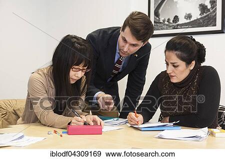 Teacher-student situation in an international class, adult education View Large Photo Image Stock Photo - Teacher-student situation in an international class, adult education. Fotosearch