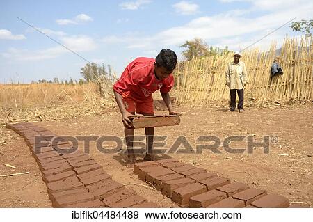 Teenager manufacturing bricks, Analakely village, Tanambao commune, Tsiroanomandidy district, Bongolava region, Madagascar, Africa View Large Photo Image Stock Photo - Teenager manufacturing bricks, Analakely village, Tanambao commune, Tsiroanomandidy district, Bongolava region, Madagascar, Africa. Fotosearch