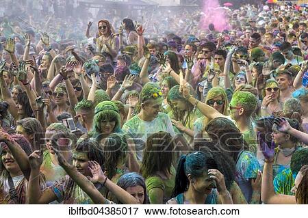 Thousands of young women and man are raising their arms at the colorful Holi festival, Dresden, Saxony, Germany, Europe View Large Photo Image Stock Photo - Thousands of young women and man are raising their arms at the colorful Holi festival, Dresden, Saxony, Germany, Europe. Fotosearch