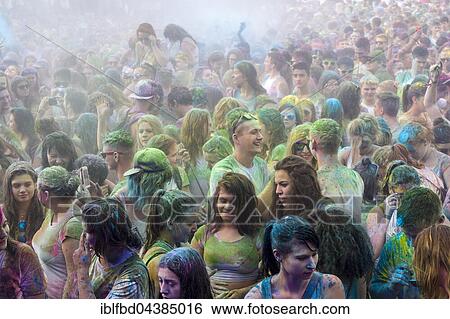 Thousands of young women and man are hardly visible because of color powder in the air at the colorful Holi festival, Dresden, Saxony, Germany, Europe View Large Photo Image Stock Photograph - Thousands of young women and man are hardly visible because of color powder in the air at the colorful Holi festival, Dresden, Saxony, Germany, Europe. Fotosearch