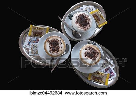 Three cappuccino on silver trays View Large Photo Image Picture - Three cappuccino on silver trays. Fotosearch