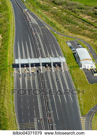 Toll station, N18 road before Shannon Tunnel, Limerick, County Clare, Ireland, Europe View Large Photo Image Stock Photo - Toll station, N18 road before Shannon Tunnel, Limerick, County Clare, Ireland, Europe. Fotosearch