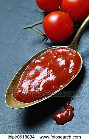 Tomato ketchup in spoon and tomatoes View Large Photo Image Stock Image - Tomato ketchup in spoon and tomatoes. Fotosearch