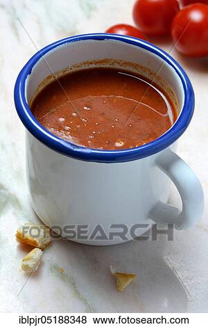 Tomato soup in cup and tomatoes, Solanum lycopersicum View Large Photo Image Stock Photo - Tomato soup in cup and tomatoes, Solanum lycopersicum. Fotosearch