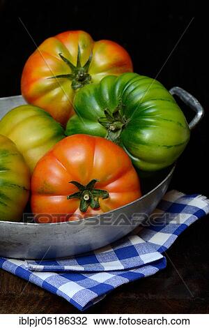 Stock Image - Tomatoes in bowl, Emilia-Romagna, variety Costoluto di Parma, Italy, Europe. Fotosearch