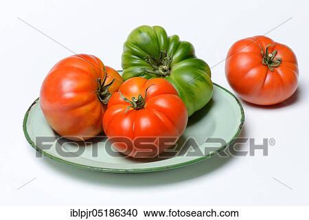 Tomatoes on plate, Emilia-Romagna, variety Costoluto di Parma, Italy, Europe View Large Photo Image Stock Image - Tomatoes on plate, Emilia-Romagna, variety Costoluto di Parma, Italy, Europe. Fotosearch