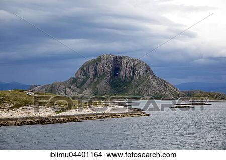 Torghatten granite mountain with a hole through it, Torget island, Brønnøy, Nordland county, Norway, Europe View Large Photo Image Picture - Torghatten granite mountain with a hole through it, Torget island, Brønnøy, Nordland county, Norway, Europe. Fotosearch