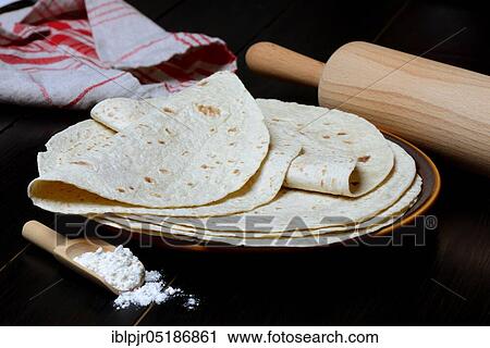 Tortillas on plate and rolling pin, wrap, wraps, mexican, mexican View Large Photo Image Stock Image - Tortillas on plate and rolling pin, wrap, wraps, mexican, mexican. Fotosearch