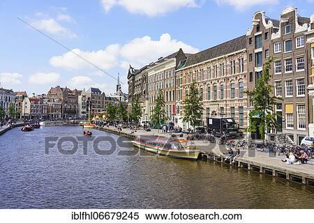 Tour boat on the Amstel river, Amsterdam, Netherlands View Large Photo Image Stock Photography - Tour boat on the Amstel river, Amsterdam, Netherlands. Fotosearch