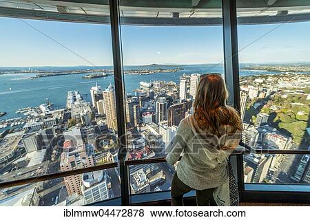 Tourist enjoying the view from the observation deck of the Sky Tower, skyline with skyscrapers, Central Business District, Auckland Region, North Island, New Zealand, Oceania View Large Photo Image Stock Photo - Tourist enjoying the view from the observation deck of the Sky Tower, skyline with skyscrapers, Central Business District, Auckland Region, North Island, New Zealand, Oceania. Fotosearch