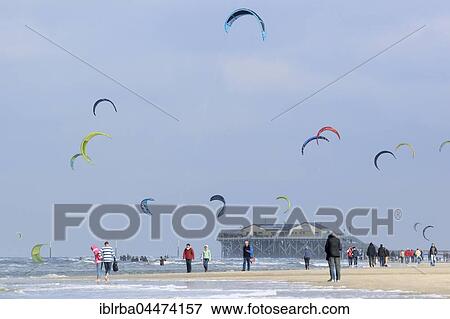 Tourists and kitesurfers on beach, Sankt Peter-Ording, Schleswig-Holstein Wadden Sea National Park, North Frisia, Schleswig-Holstein, Germany, Europe View Large Photo Image Stock Photo - Tourists and kitesurfers on beach, Sankt Peter-Ording, Schleswig-Holstein Wadden Sea National Park, North Frisia, Schleswig-Holstein, Germany, Europe. Fotosearch