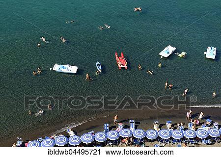 Tourists, bathers on the beach with sunshades, bird's eye view, Sorrento, Sorrentine Peninsula, Amalfi Coast, Campania, Italy, Europe View Large Photo Image Stock Image - Tourists, bathers on the beach with sunshades, bird's eye view, Sorrento, Sorrentine Peninsula, Amalfi Coast, Campania, Italy, Europe. Fotosearch