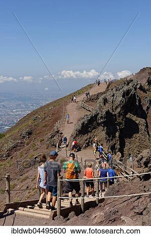 Stock Image - Tourists on a path along the crater edge, Vesuvius, near Naples, Parco Nazionale del Vesuvio, Campania, Italy, Europe. Fotosearch