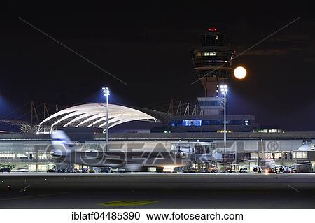 Stock Image - Tower with full moon, Terminal 1, Munich Airport, Upper Bavaria, Bavaria, Germany, Europe. Fotosearch