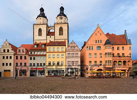 Stock Image - Town Hall Square in Wittenberg overlooking the St. Mary's Church, Lutherstadt Wittenberg, Saxony-Anhalt, Germany, Europe. Fotosearch